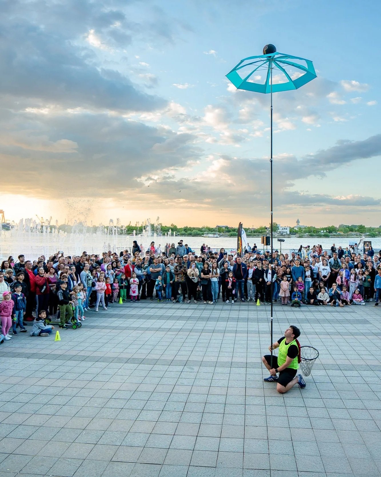 Stefan Florescu balancing an umbrella at a festival